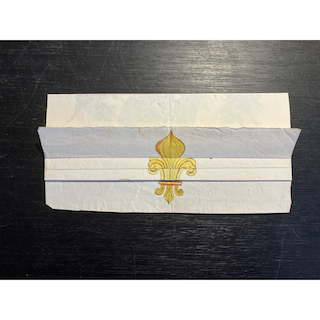 Feuille pliée montrant une fleur de lys et dépliée figurant Bonaparte